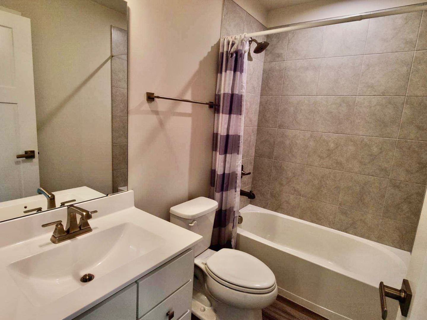 319 Elm Ct., Unit 319 Mount Prospect, IL 60056 - Photo 19 of 21 a bathroom with a sink toilet and shower
