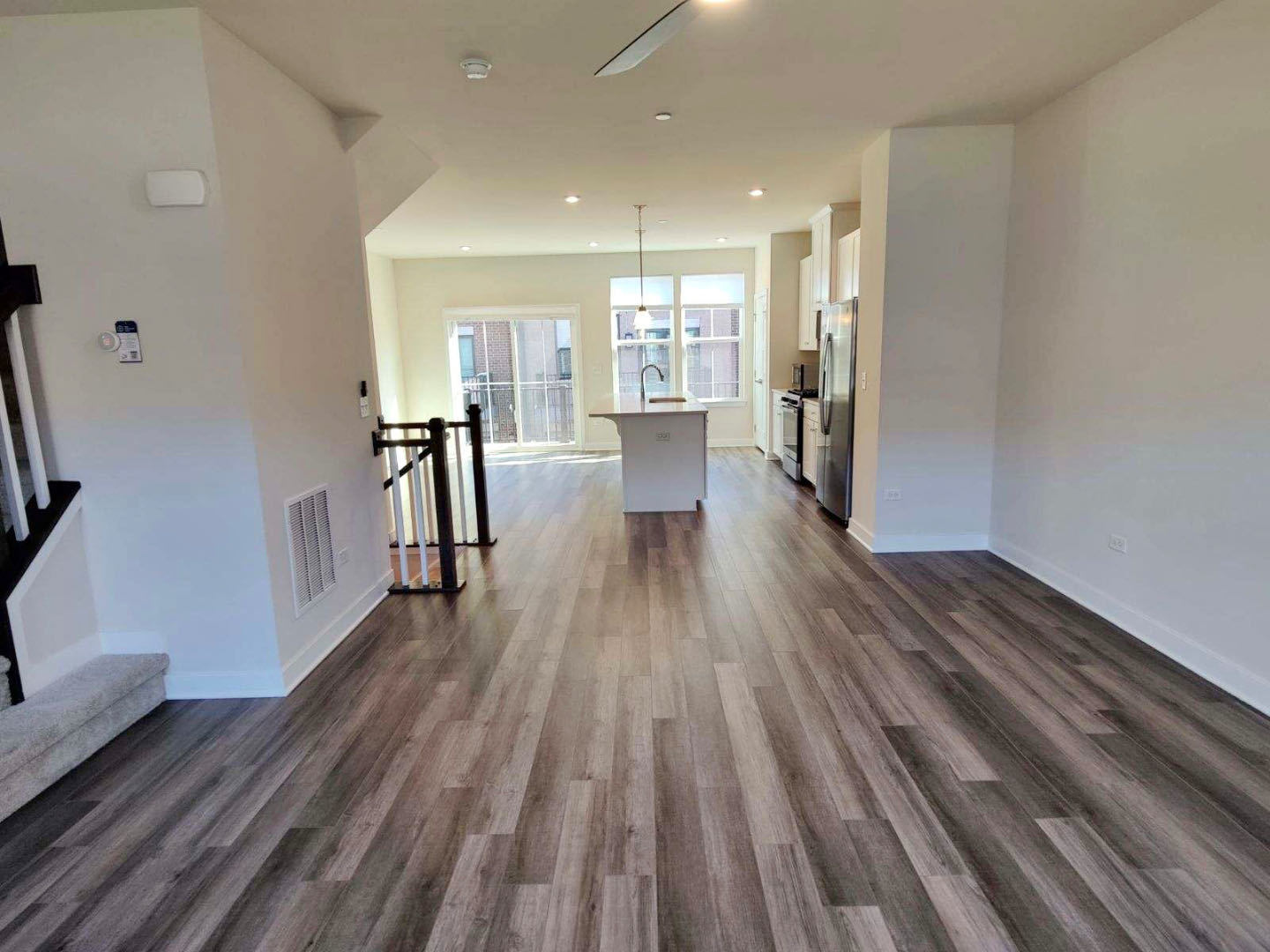 319 Elm Ct., Unit 319 Mount Prospect, IL 60056 - Photo 10 of 21 a view of a living room with wooden floor