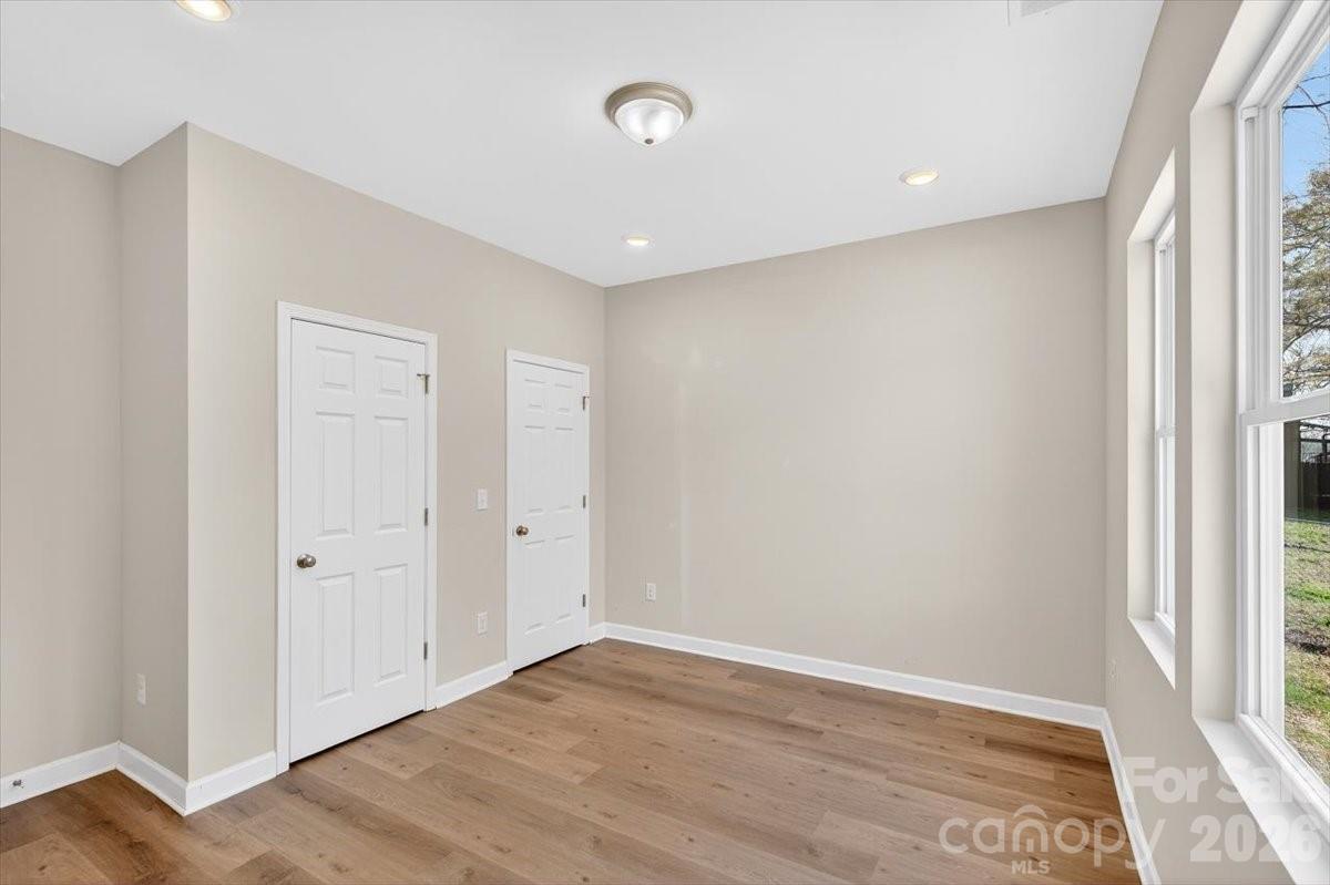 811 Craig Place Shelby, NC 28150 - Photo 16 of 28 a view of an empty room with wooden floor and a window