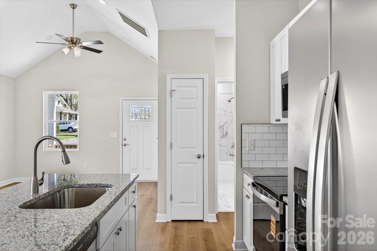 811 Craig Place Shelby, NC 28150 - Photo 8 of 28 a kitchen with refrigerator sink and cabinets