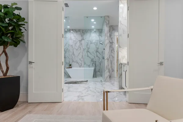 a bathroom with a bathtub and shower