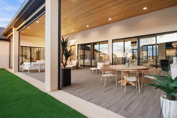 a dining room with furniture and wooden floor