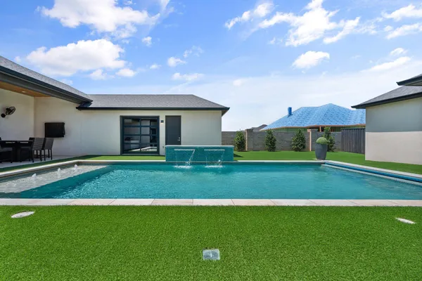 a view of a big house with a big yard