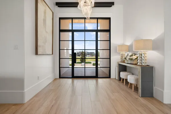 a view of a livingroom with furniture and a window