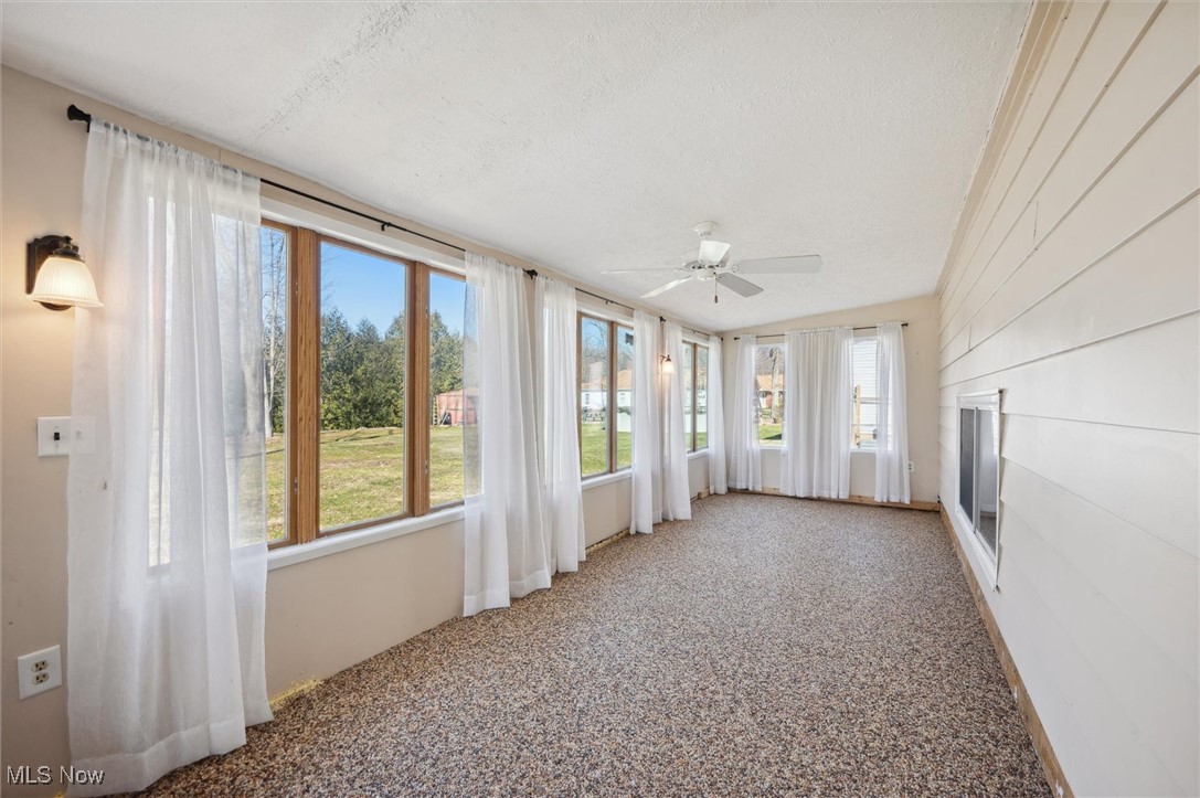 5476 Lear Nagle Road North Ridgeville, OH 44039 - Photo 31 of 38 Unfurnished sunroom with a ceiling fan