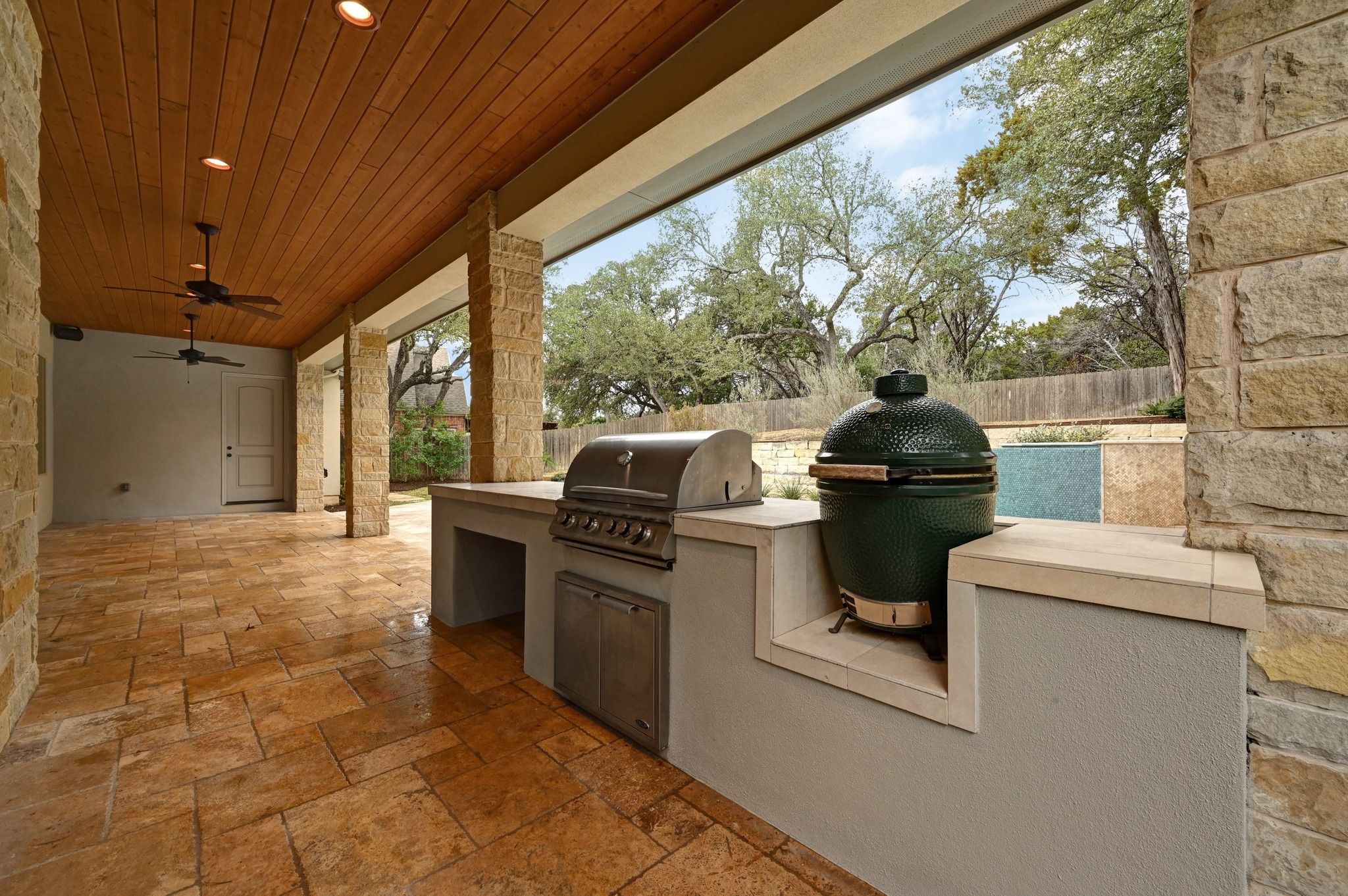 2800 Barton Point Drive Austin, TX 78733 - Photo 28 of 40 Fenced backyard featuring an outdoor kitchen, a patio, and a ceiling fan