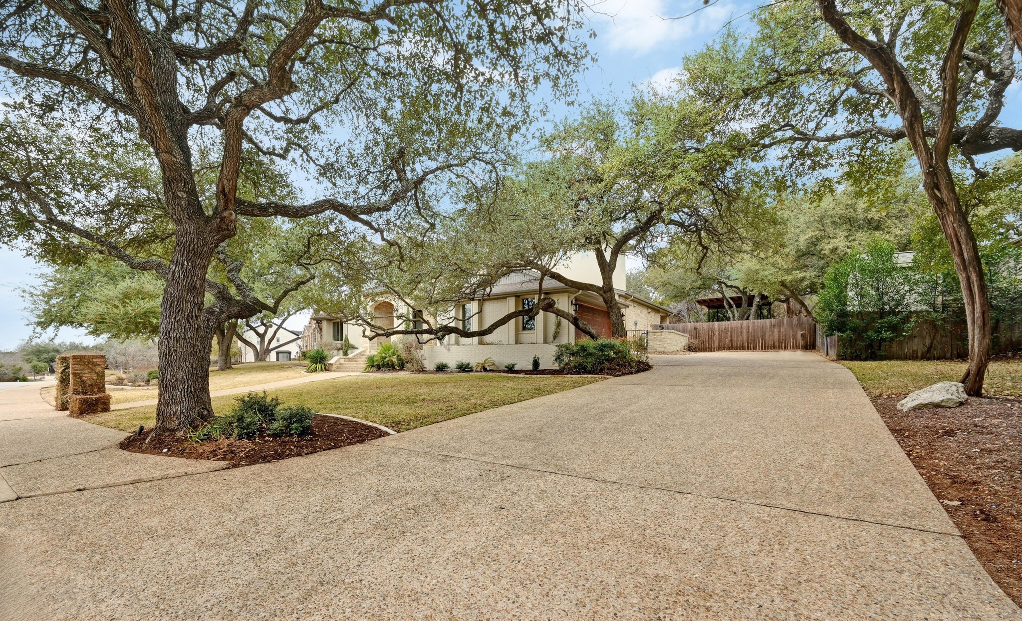 2800 Barton Point Drive Austin, TX 78733 - Photo 35 of 40 View of front of property with driveway and stucco siding