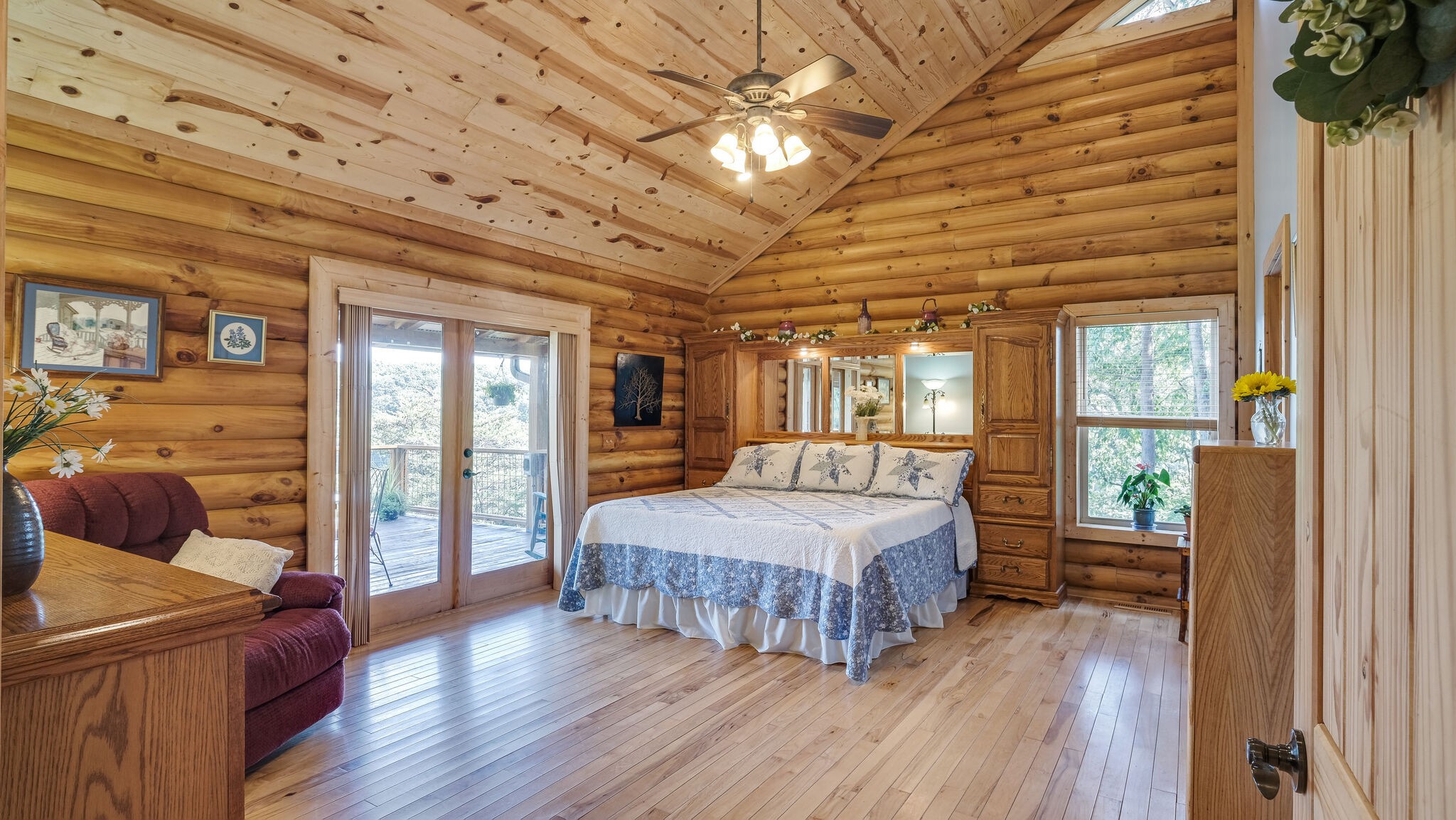 700 Haynes Road Sewanee, TN 37375 - Photo 22 of 41 a bedroom with a large bed and a chandelier