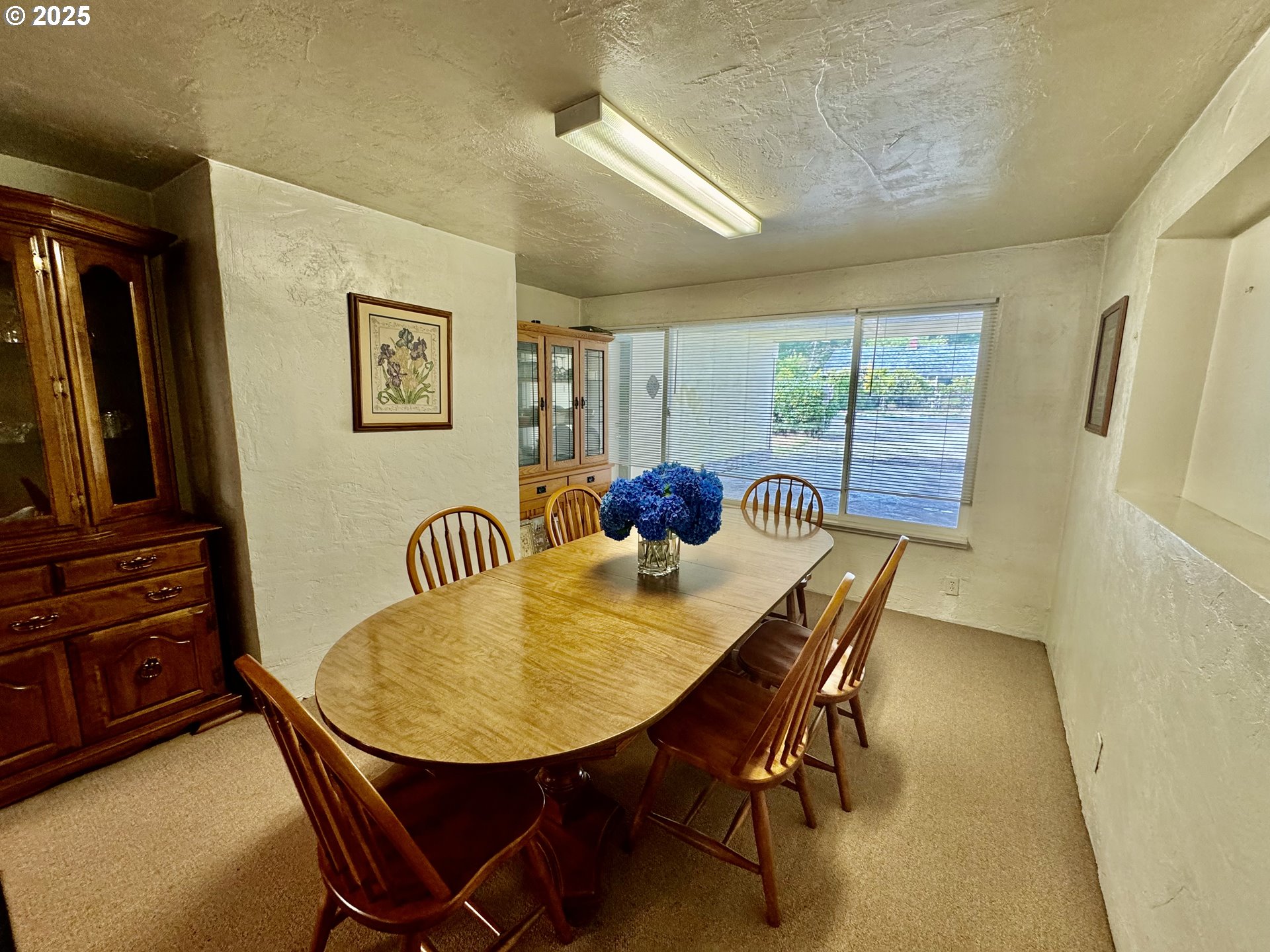4990 Mitchell Loop Road Florence, OR 97439 - Photo 12 of 35 a dining room with furniture and window