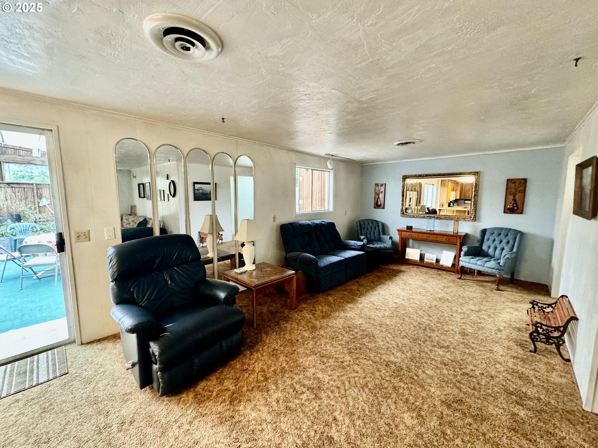 4990 Mitchell Loop Road Florence, OR 97439 - Photo 18 of 35 a living room with furniture window and a table