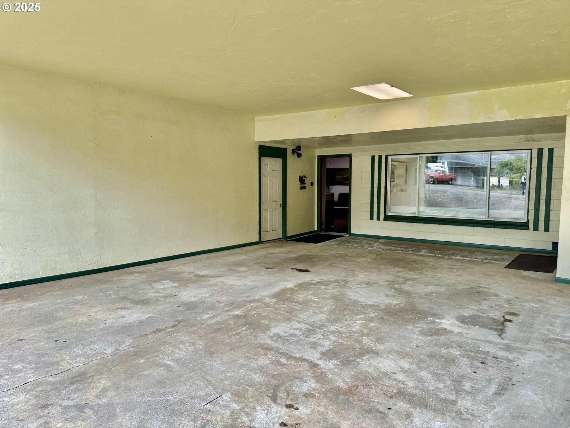4990 Mitchell Loop Road Florence, OR 97439 - Photo 3 of 35 an empty room with windows
