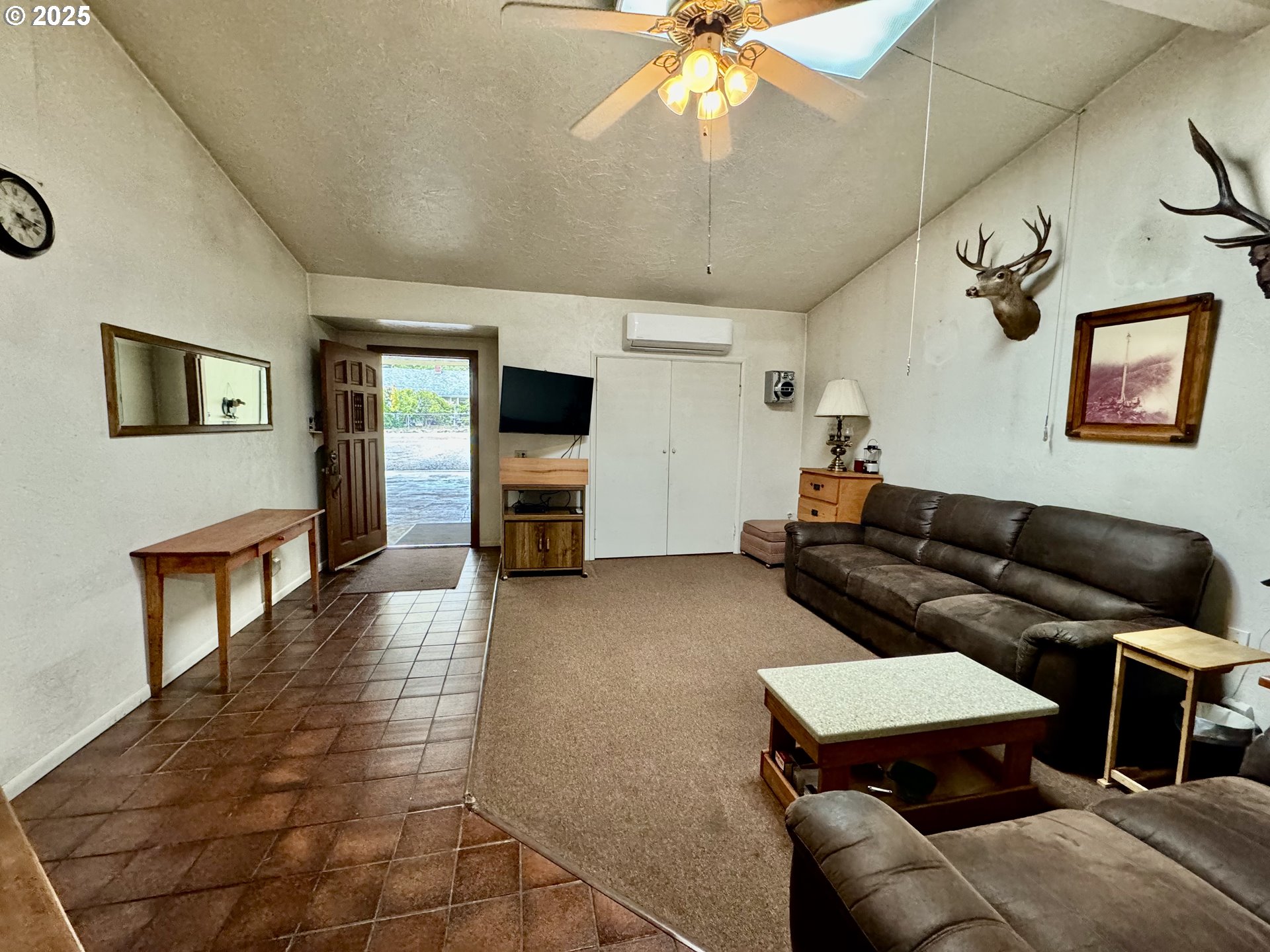 4990 Mitchell Loop Road Florence, OR 97439 - Photo 6 of 35 a living room with furniture and a flat screen tv