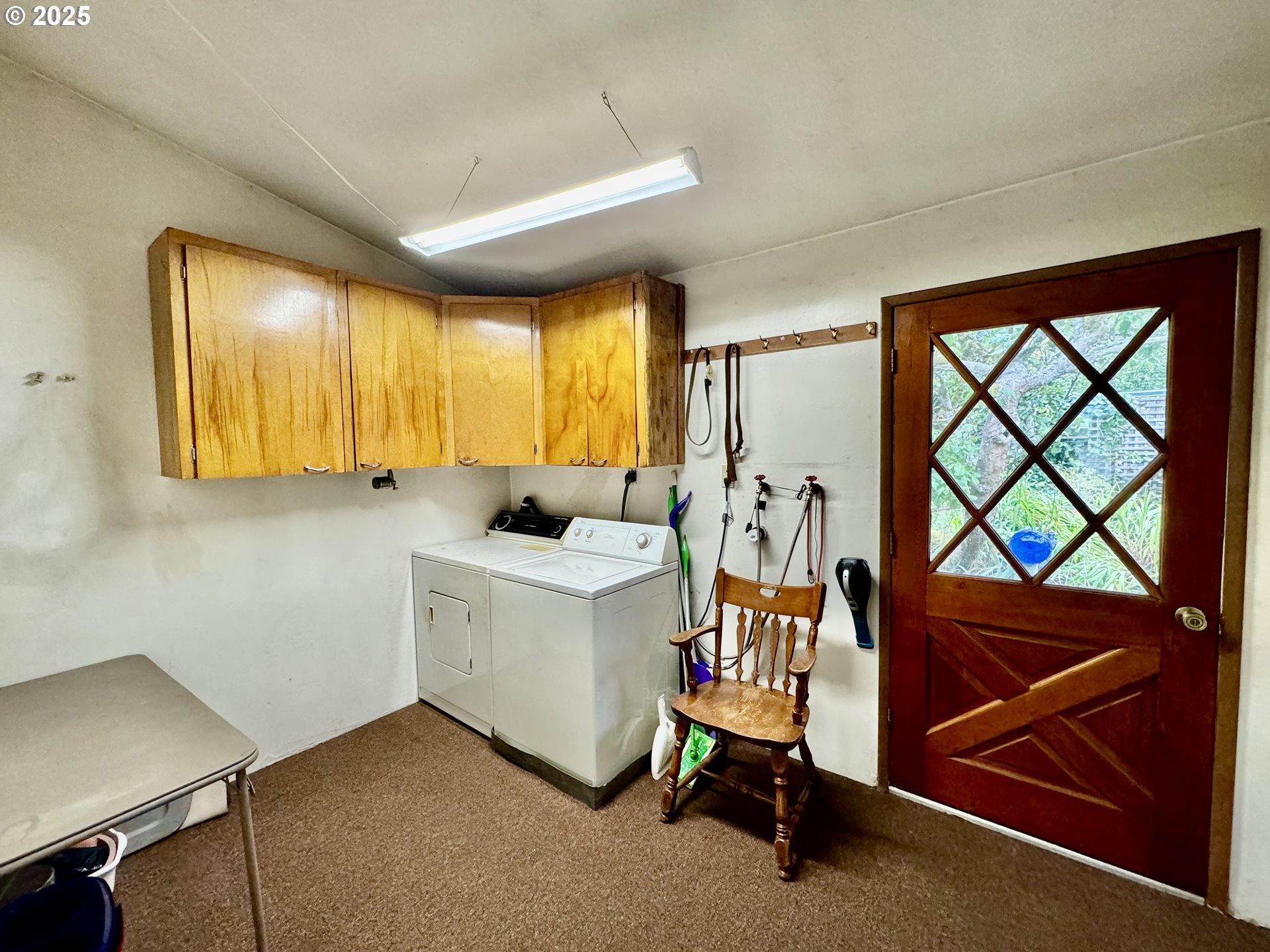 4990 Mitchell Loop Road Florence, OR 97439 - Photo 7 of 35 a view of room with furniture and windows