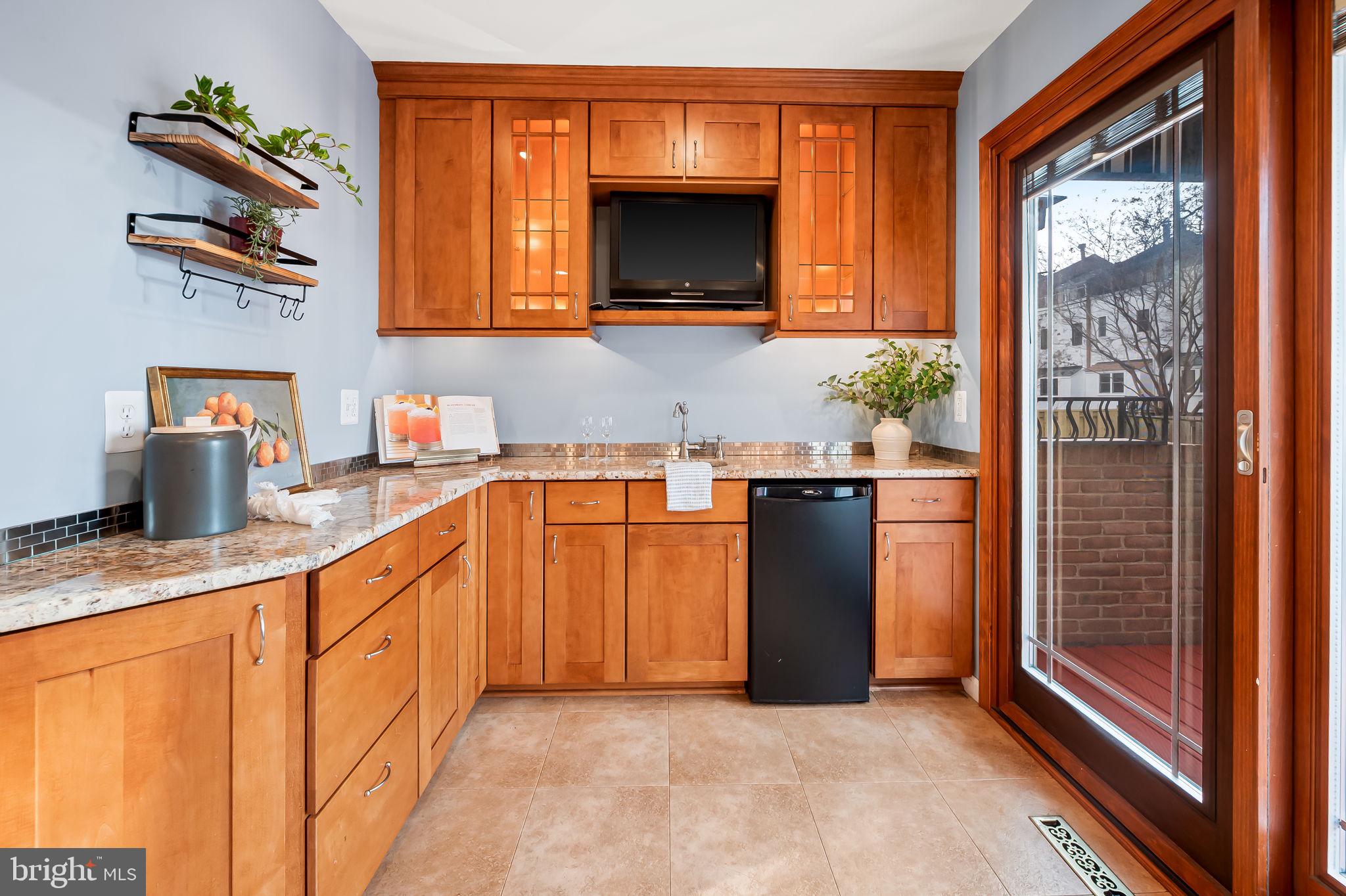 612 Pubped Way Baltimore, MD 21230 - Photo 17 of 55 a kitchen with stainless steel appliances granite countertop a refrigerator and a sink