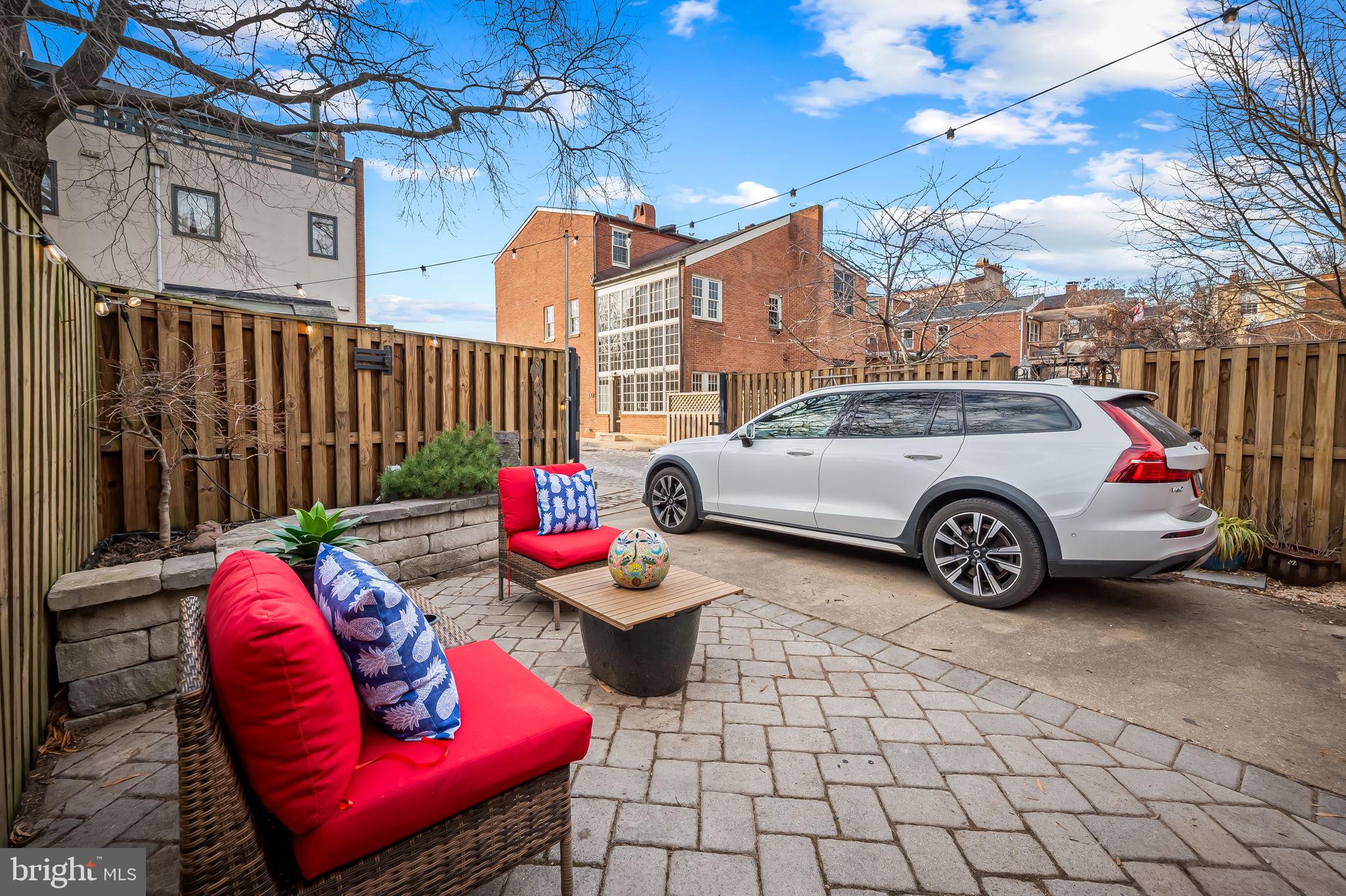 612 Pubped Way Baltimore, MD 21230 - Photo 20 of 55 a view of a red car parked in front of a building