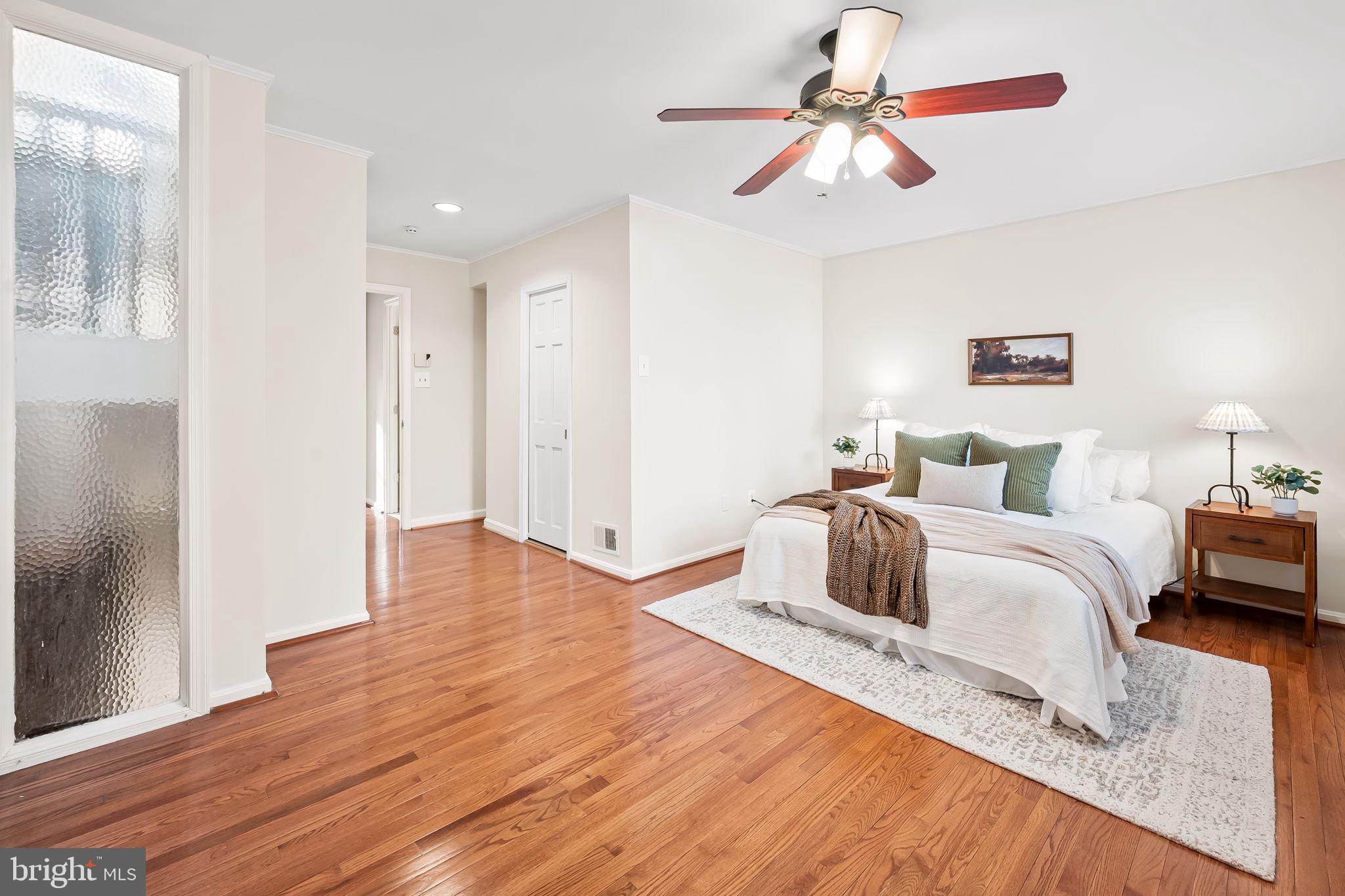 612 Pubped Way Baltimore, MD 21230 - Photo 26 of 55 a bedroom with a bed and a chandelier