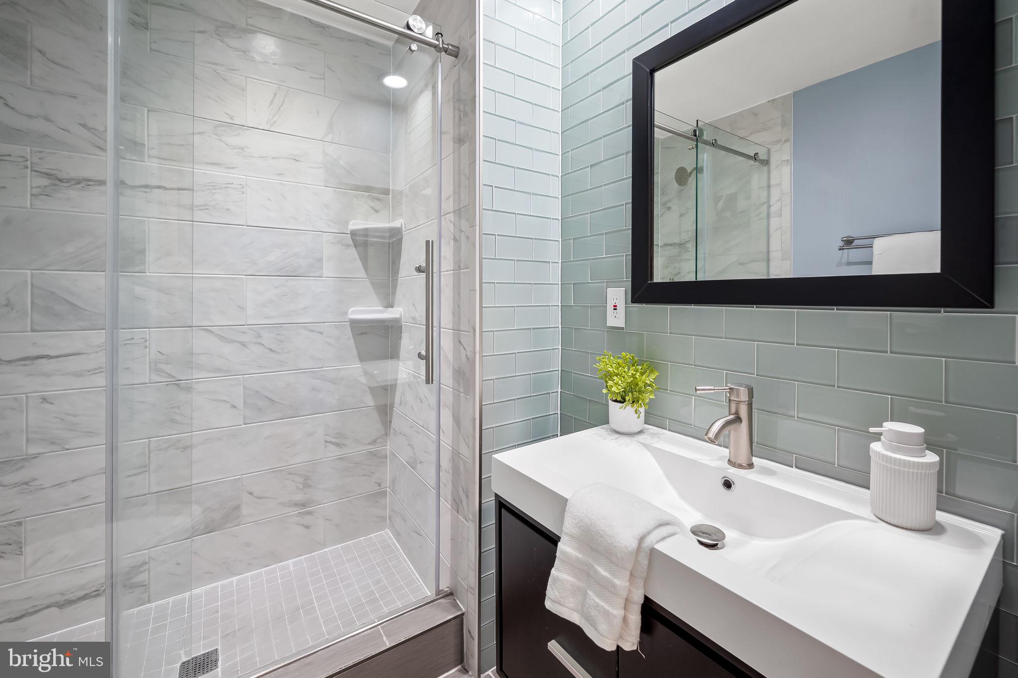 612 Pubped Way Baltimore, MD 21230 - Photo 27 of 55 a bathroom with a sink a toilet and shower