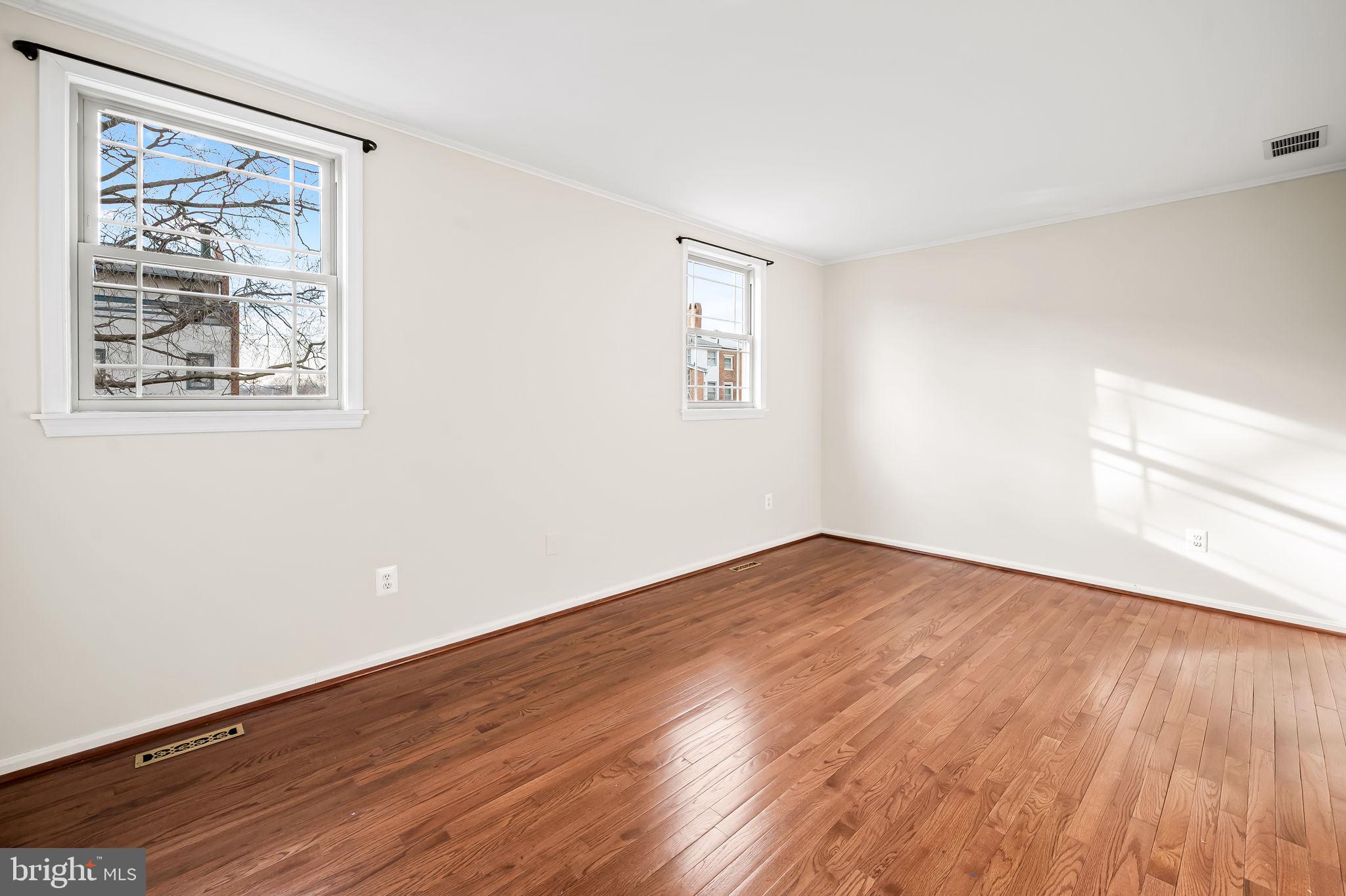 612 Pubped Way Baltimore, MD 21230 - Photo 30 of 55 a view of an empty room with wooden floor and a window