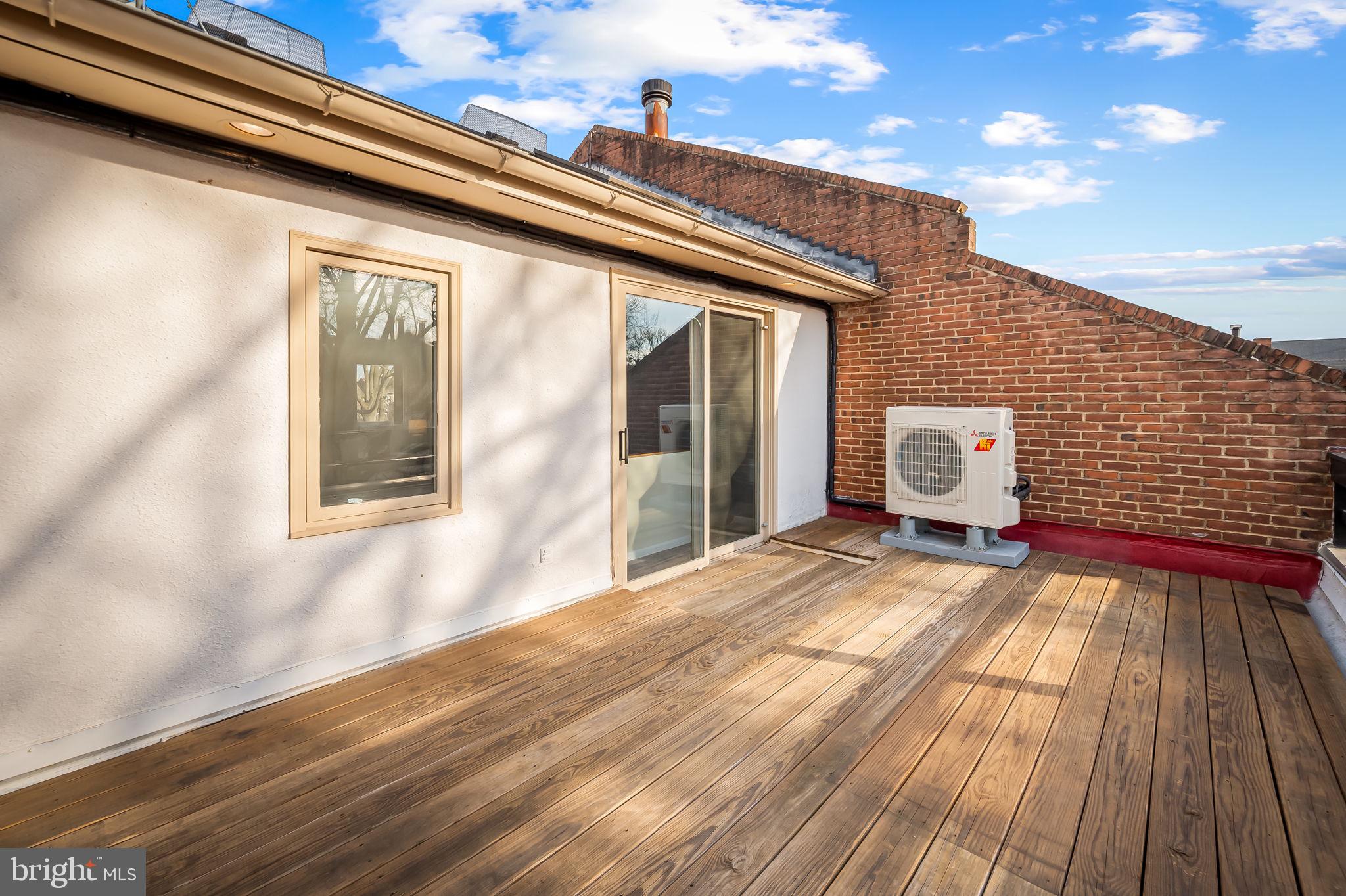 612 Pubped Way Baltimore, MD 21230 - Photo 40 of 55 a view of a patio with wooden floor and fence