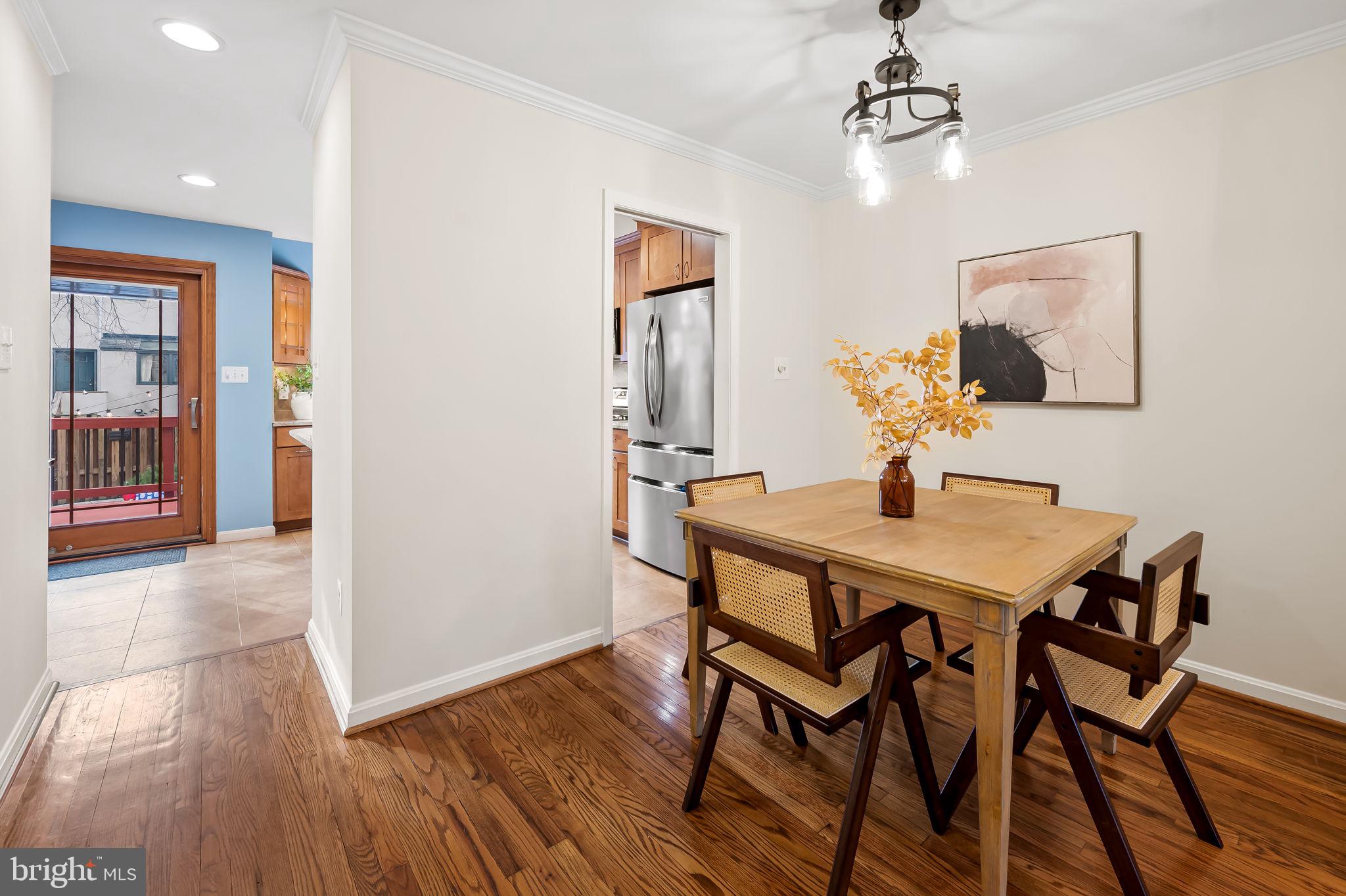 612 Pubped Way Baltimore, MD 21230 - Photo 10 of 55 a view of a dining room with furniture and wooden floor