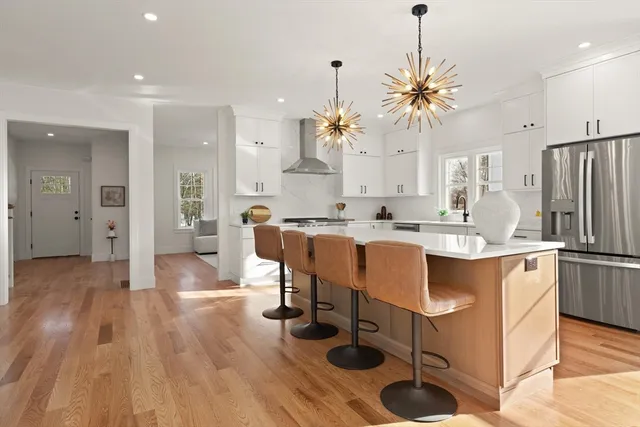 a large kitchen with lots of counter space and stainless steel appliances