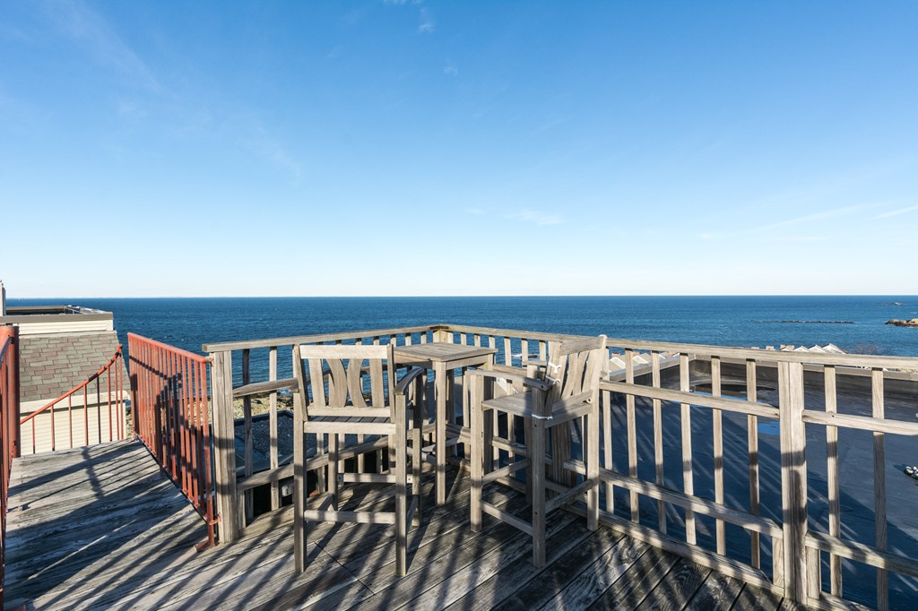 63 Oceanside Drive, Unit 63 Hull, MA 02045 - Photo 11 of 30 a view of wooden chairs