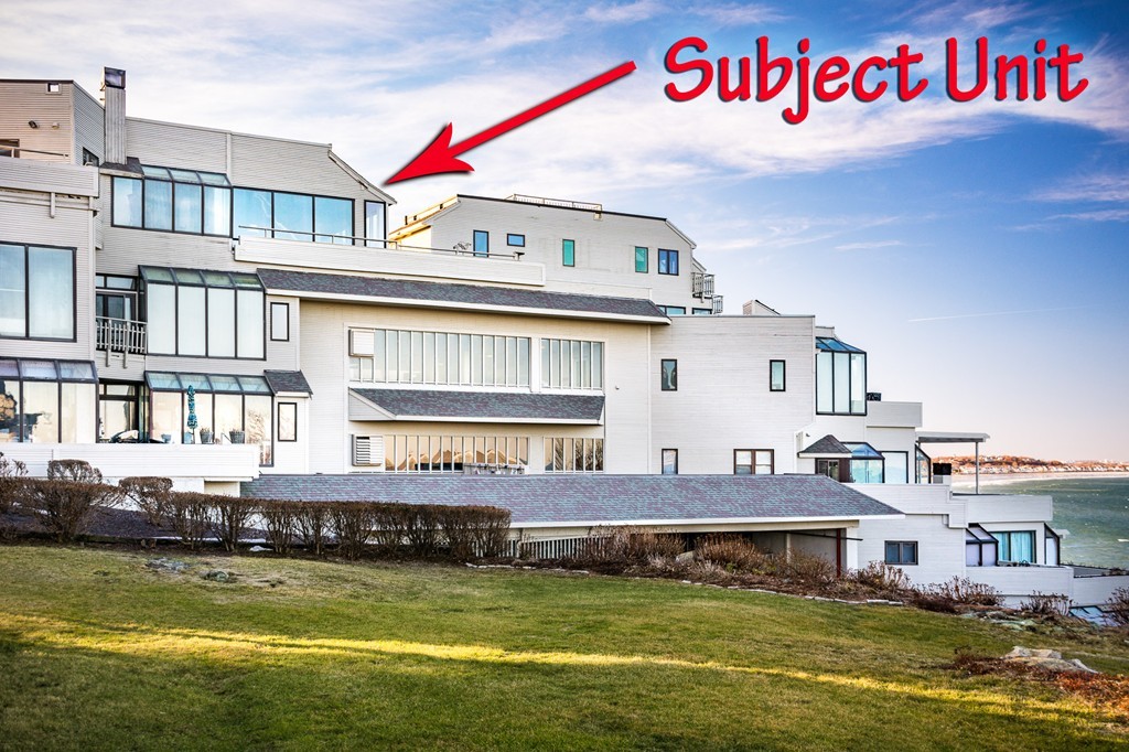 63 Oceanside Drive, Unit 63 Hull, MA 02045 - Photo 2 of 30 a view of a building with swimming pool and a yard