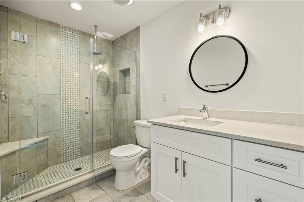 13846 Sleepy Hollow Lane Fort Myers, FL 33905 - Photo 24 of 46 a bathroom with a sink a toilet and a mirror