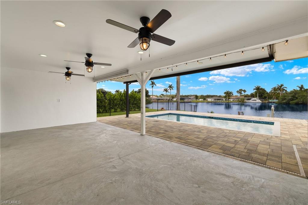 13846 Sleepy Hollow Lane Fort Myers, FL 33905 - Photo 25 of 46 a view of a water heater room with a ceiling fan