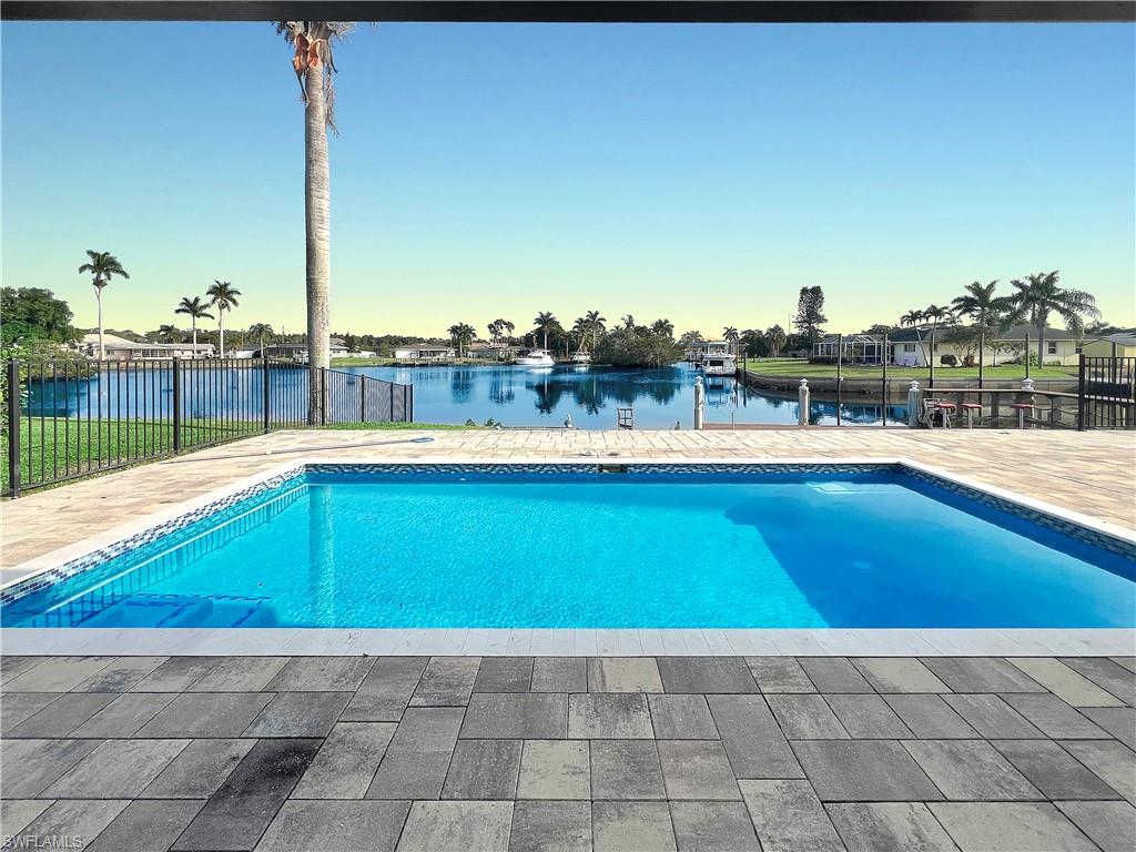 13846 Sleepy Hollow Lane Fort Myers, FL 33905 - Photo 26 of 46 a view of a swimming pool with a lounge chair