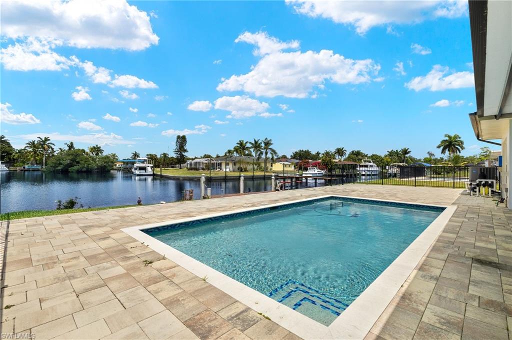 13846 Sleepy Hollow Lane Fort Myers, FL 33905 - Photo 27 of 46 a view of a swimming pool and a yard