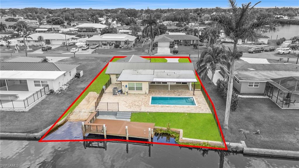 13846 Sleepy Hollow Lane Fort Myers, FL 33905 - Photo 34 of 46 an aerial view of a tennis ground with large trees