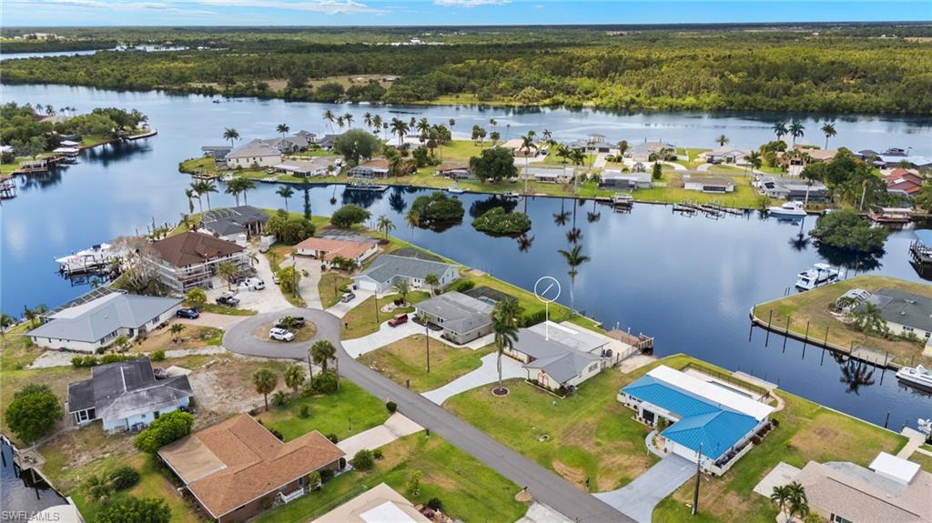13846 Sleepy Hollow Lane Fort Myers, FL 33905 - Photo 37 of 46 an aerial view of a house with a lake view