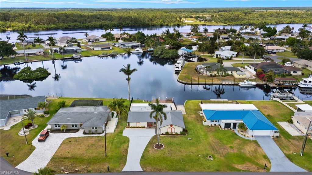 13846 Sleepy Hollow Lane Fort Myers, FL 33905 - Photo 41 of 46 an aerial view of a swimming pool with outdoor seating