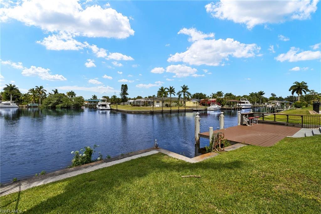 13846 Sleepy Hollow Lane Fort Myers, FL 33905 - Photo 44 of 46 a view of a lake with houses in the back