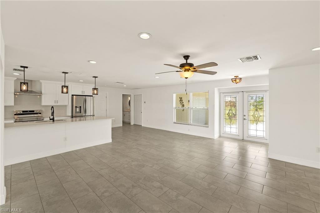 13846 Sleepy Hollow Lane Fort Myers, FL 33905 - Photo 6 of 46 a view of a living room a kitchen and a sink