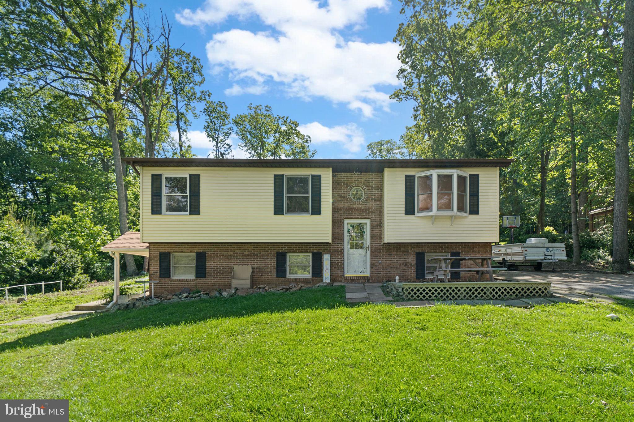 4003 Falls Road Manchester, MD 21102 - Photo 1 of 30 a aerial view of a house with a yard and sitting area