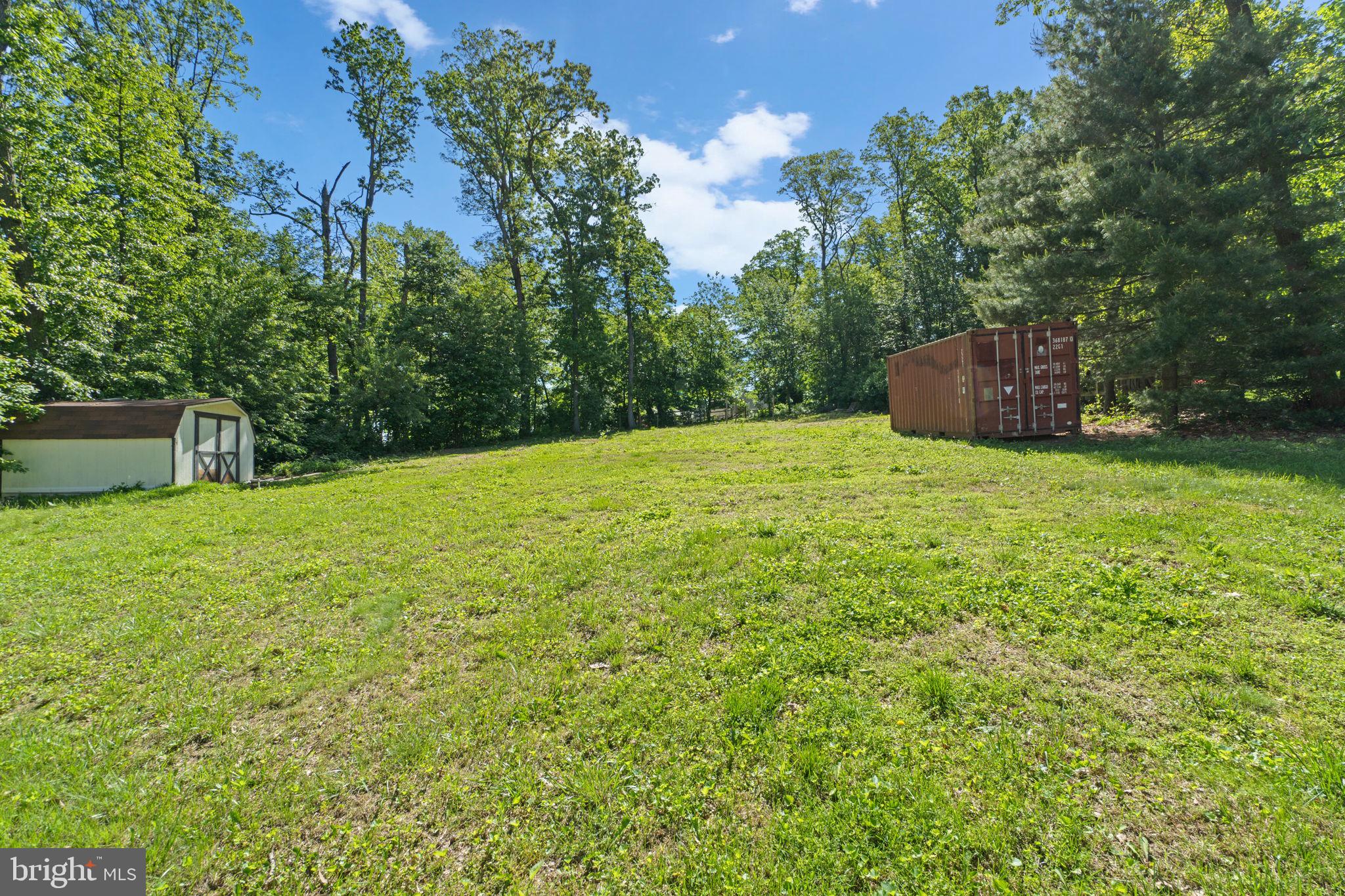 4003 Falls Road Manchester, MD 21102 - Photo 28 of 30 a backyard of a house with oven and wooden fence