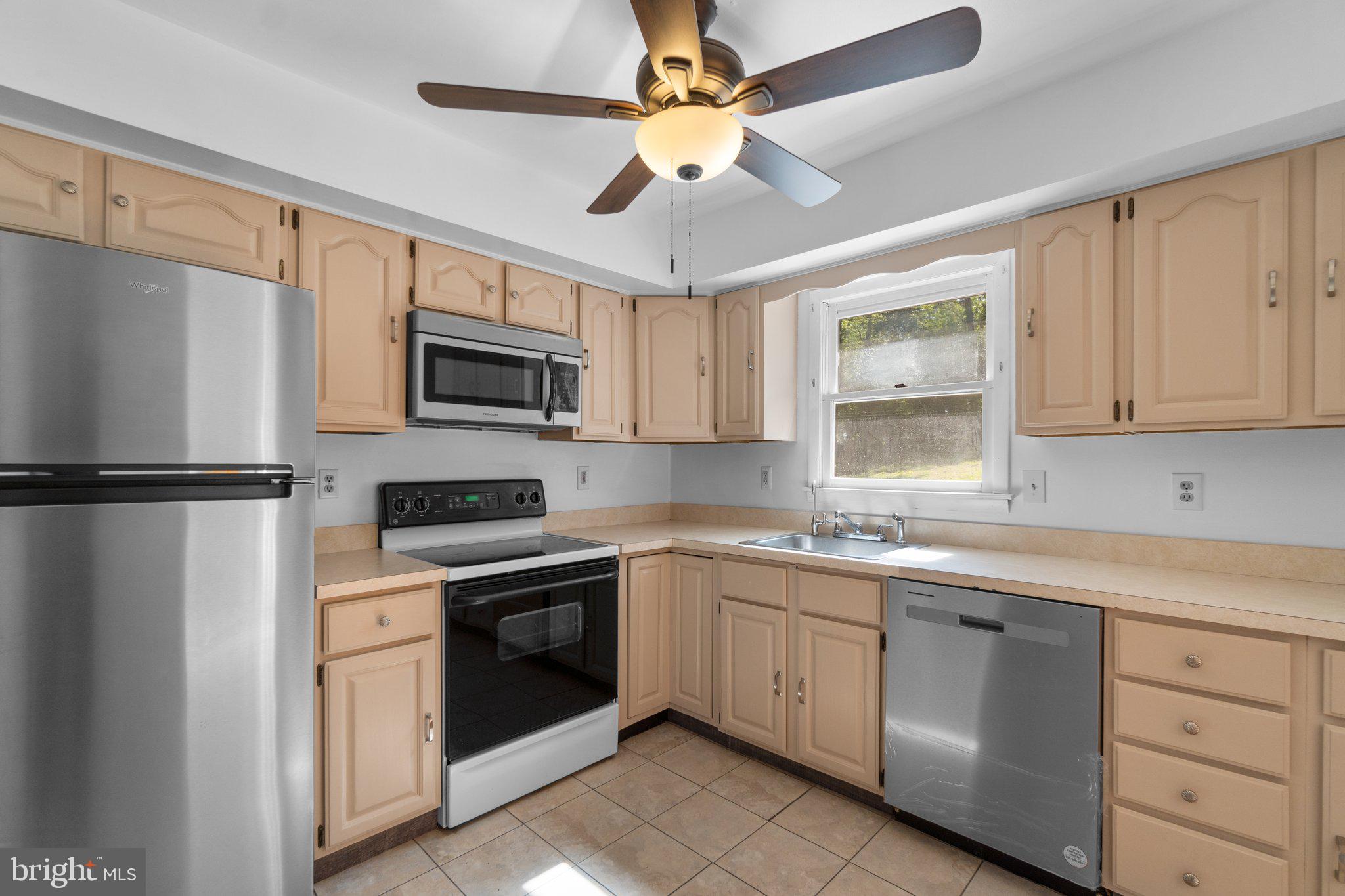 4003 Falls Road Manchester, MD 21102 - Photo 8 of 30 a kitchen with a sink stove and microwave