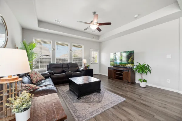 a living room with furniture and a large window