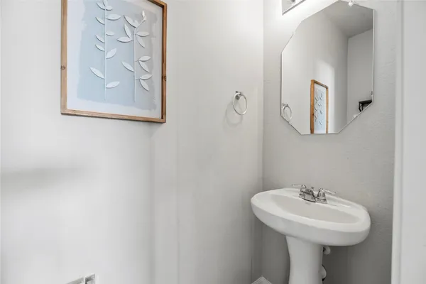 a bed sitting in a room next to a window