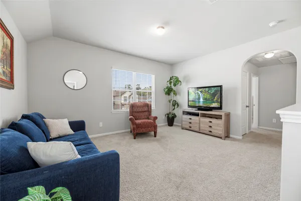 a living room with furniture and a window