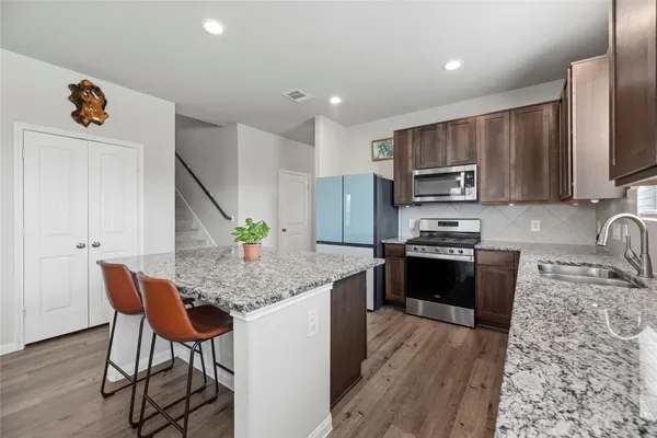 a view of a house with a yard and deck