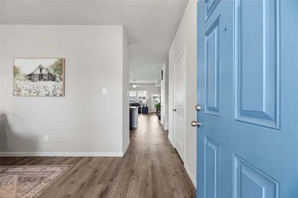 a living room with furniture a window and a table