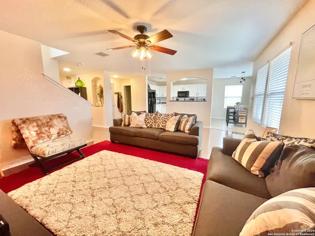 a living room with furniture and a couch
