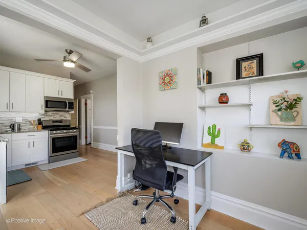 a workspace with furniture and wooden floor