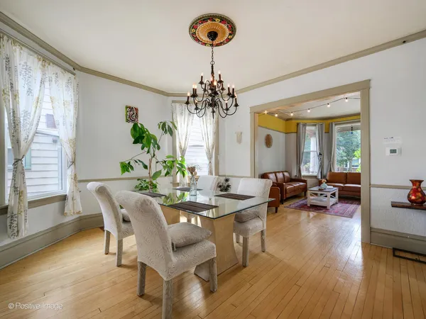 a view of a dining room with furniture and a large window