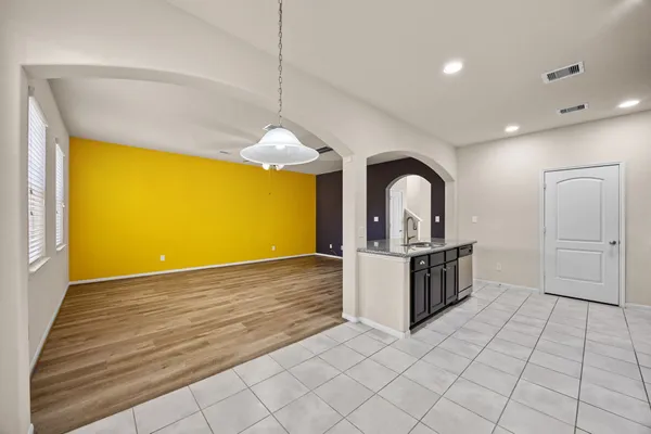 a kitchen with stainless steel appliances granite countertop a sink and a stove