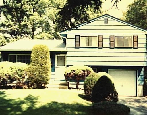 6 Algonquin Road Norwalk, CT 06851 - Photo 1 of 1 a front view of a house with yard