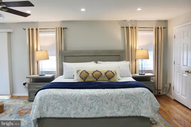 a view of a room with wooden floor and windows